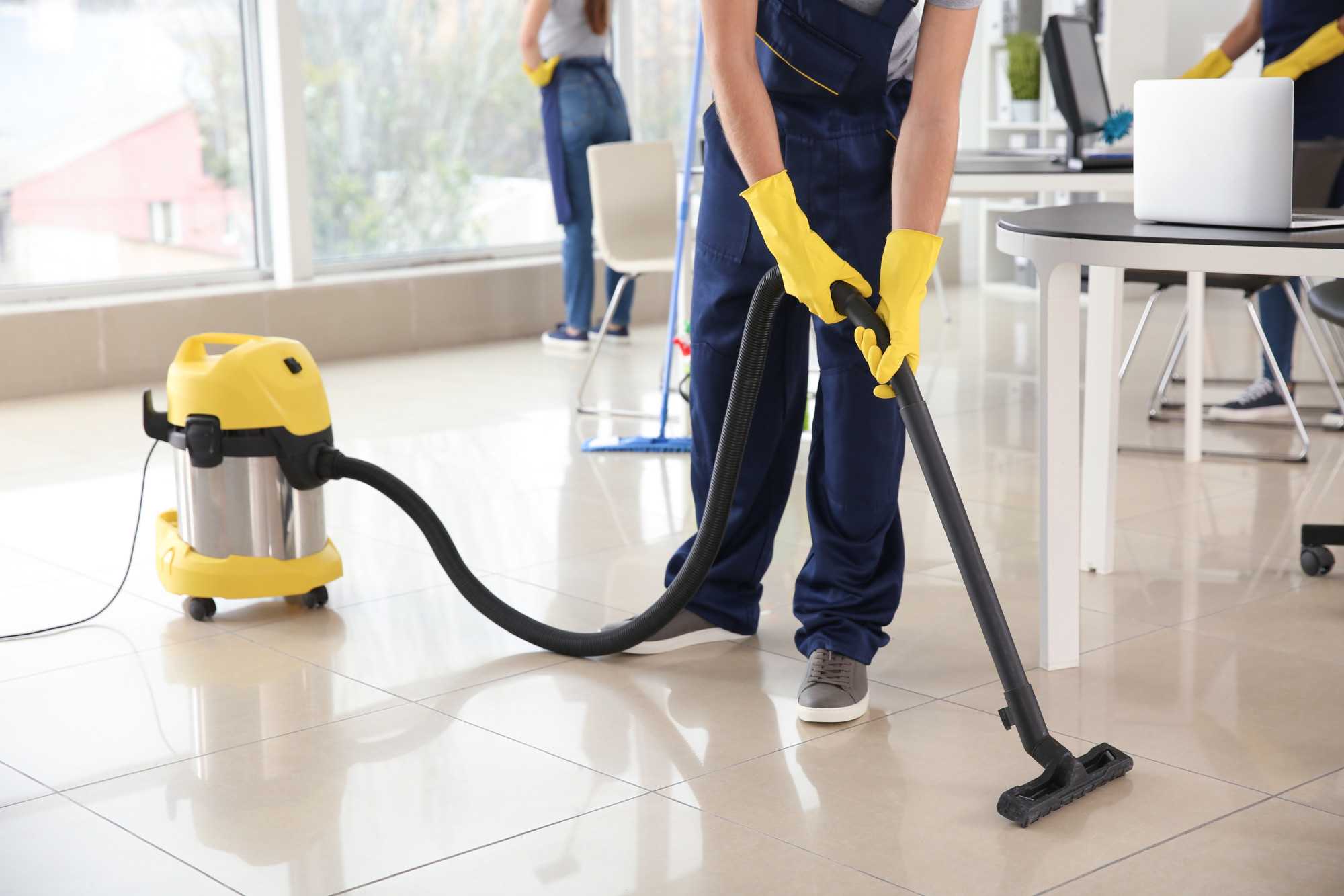 Commercial Cleaners Vacuuming the Floor